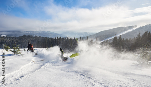Fotografie Skiing racing down from high mountain