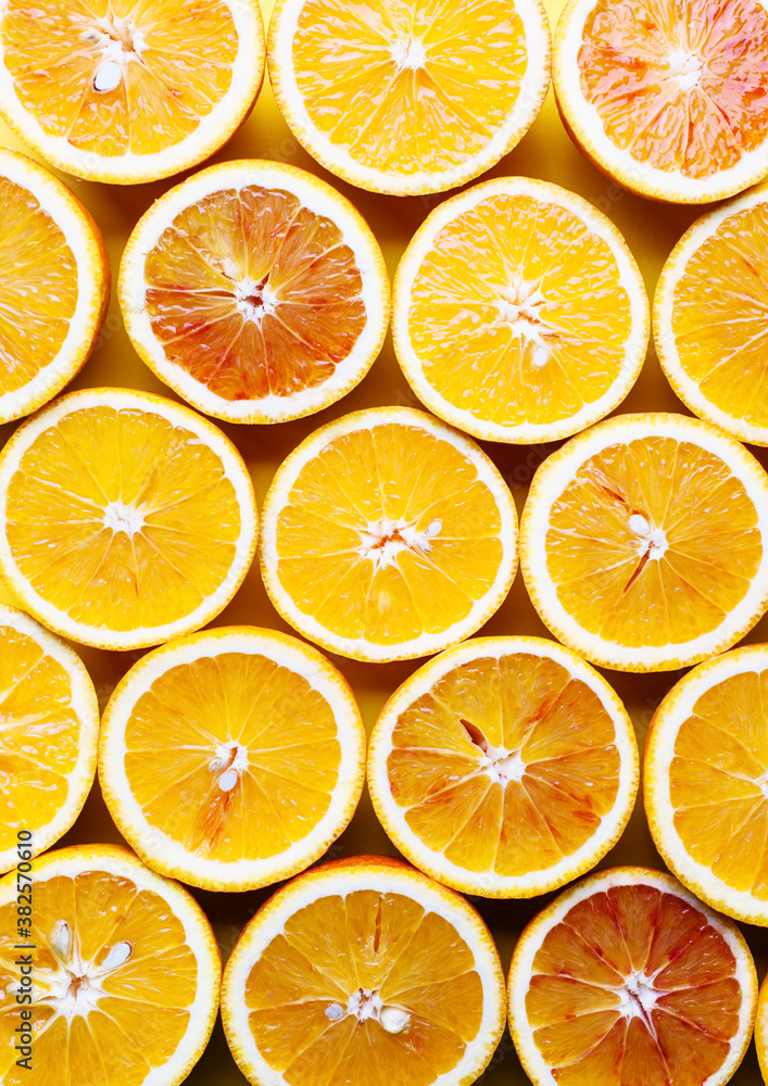 Oranges on a yellow background. Cut oranges background. Oranges on a yellow background. Cut oranges background.