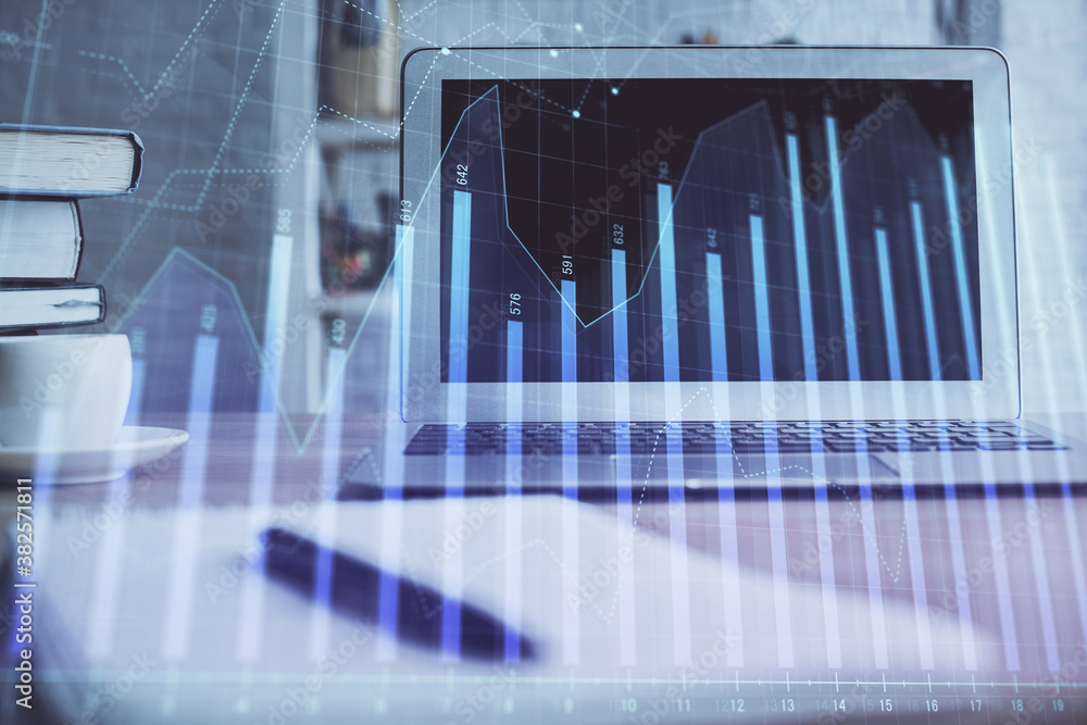 Stock market graph on background with desk and personal computer. Multi exposure. Concept of financial analysis. Stock market graph on background with desk and personal computer. Multi exposure. Concept of financial analysis.