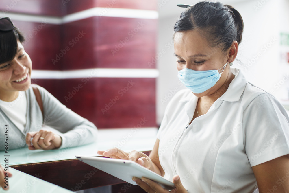 Patient and nurse with a tablet talking Patient and nurse with a tablet talking