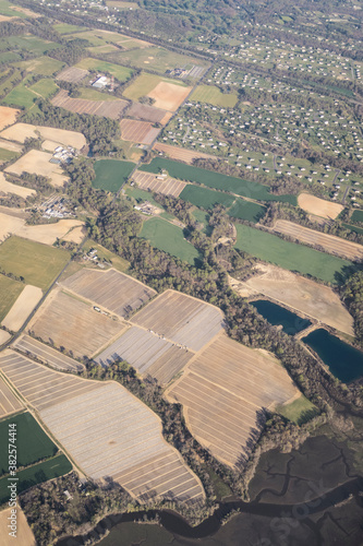 Fields and settlements seen from an airplane photo