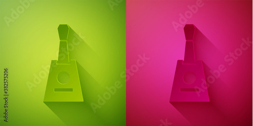Paper cut Musical instrument balalaika icon isolated on green and pink background. Paper art style. Vector.