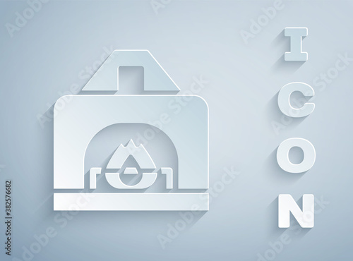 Paper cut Interior fireplace icon isolated on grey background. Paper art style. Vector.