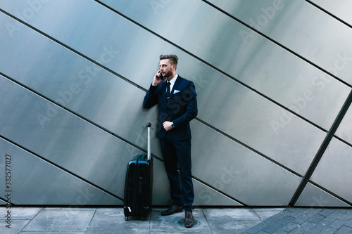 Young Businessman Travelling with His Lagguage photo