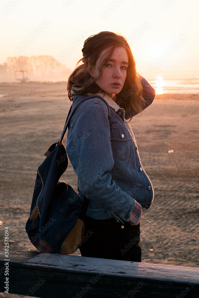 Portrait of backpacker against of sunrise at beach Portrait of backpacker against of sunrise at beach