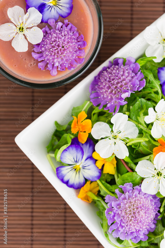 Edible flower salad with a fruit smoothie Edible flower salad with a fruit smoothie