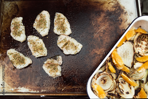 Food: Grilling herbed cod filets on a plancha photo