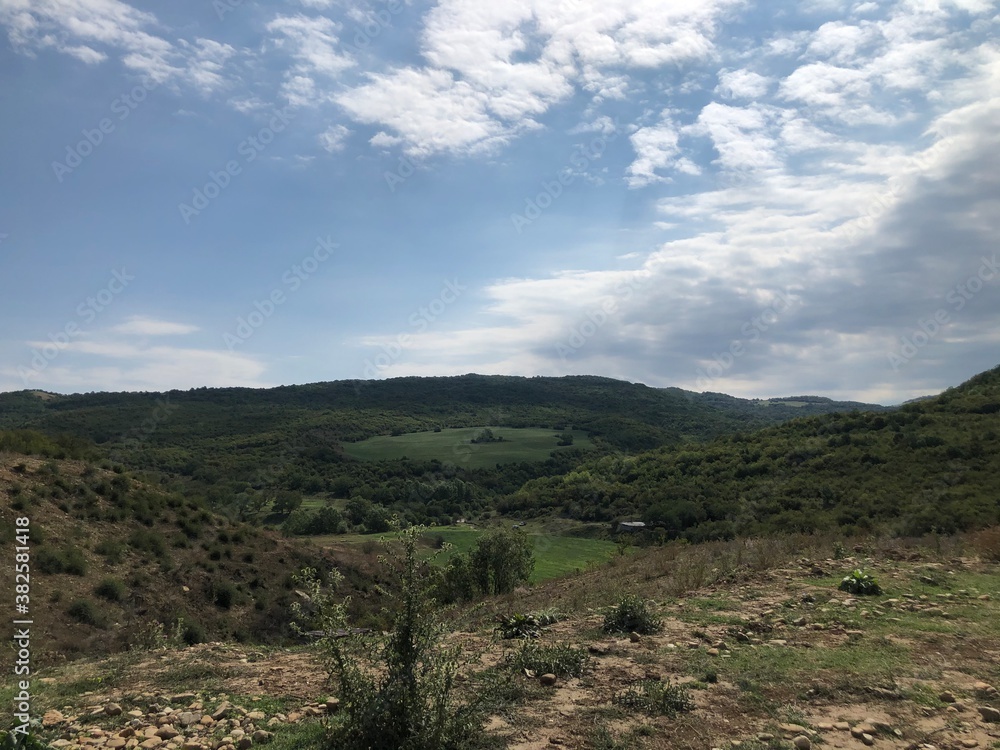 Naklejka premium clouds over the mountains