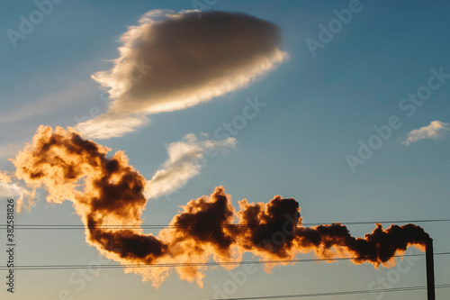 Factory Exhaust from Smokestack in Sky photo