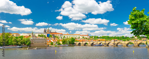 Panorama of Prague city historical centre with Prague Castle, St. Vitus Cathedral in Hradcany district, Charles Bridge Karluv Most across Vltava river. Panoramic view of Prague city, Czech Republic © Aliaksandr