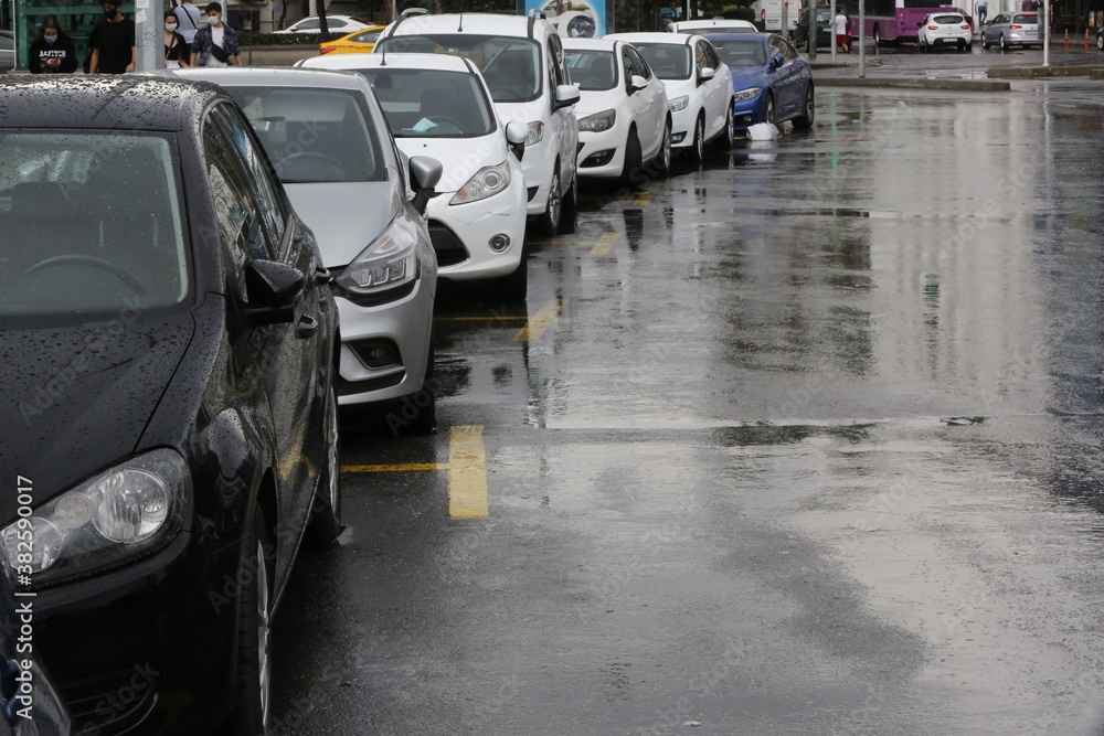 Cars parked on a rainy day
