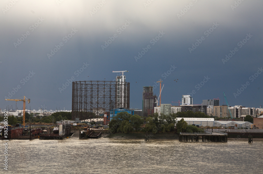 Cityscape of the Skyscrapers in the city of London financial district, by the River Thames on a cloudy day in summer Cityscape of the Skyscrapers in the city of London financial district, by the River Thames on a cloudy day in summer