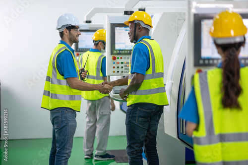 multi ethnicity engineer and workers working in line up