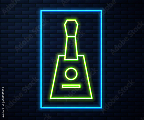 Glowing neon line Musical instrument balalaika icon isolated on brick wall background. Vector.