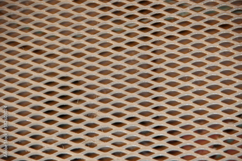 Metal brown grating close-up. Backgrounds.