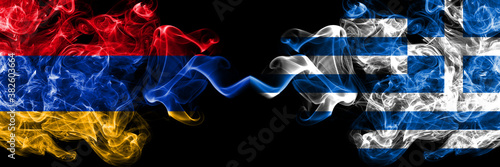 Armenia vs Greece, Greek smoky mystic flags placed side by side. Thick colored silky abstract smoke flags