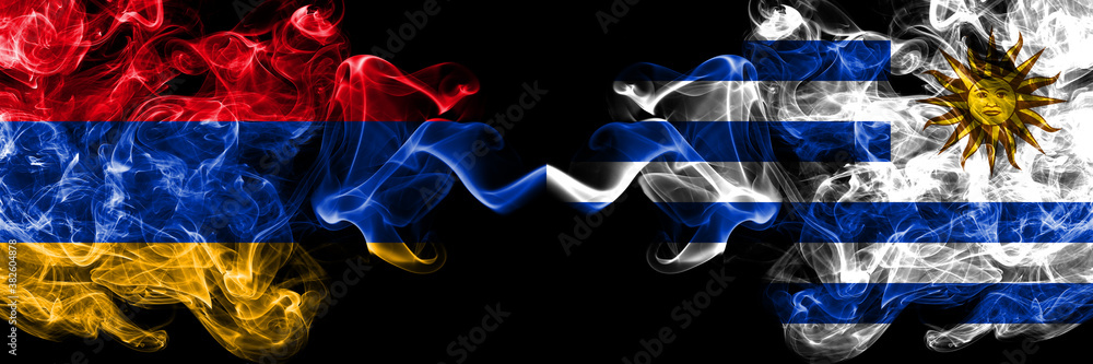 Armenia vs Uruguay, Uruguayan smoky mystic flags placed side by side. Thick colored silky abstract smoke flags