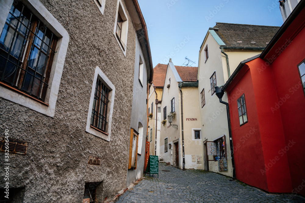 Medieval narrow street with colorful renaissance historical buildings in the center of Cesky Krumlov, South Bohemia, Czech Republic