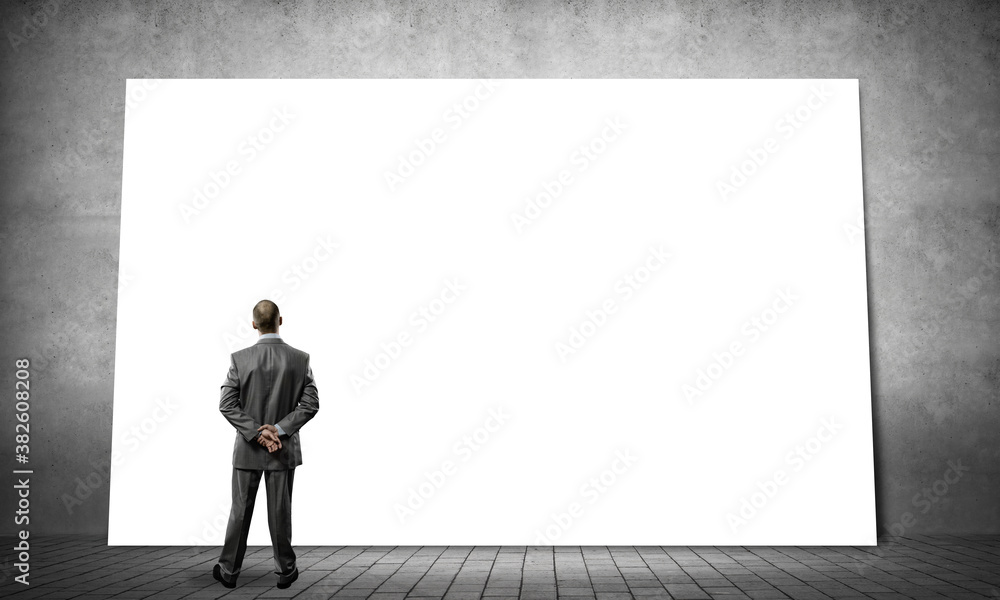Businessman and big billboard Businessman and big billboard