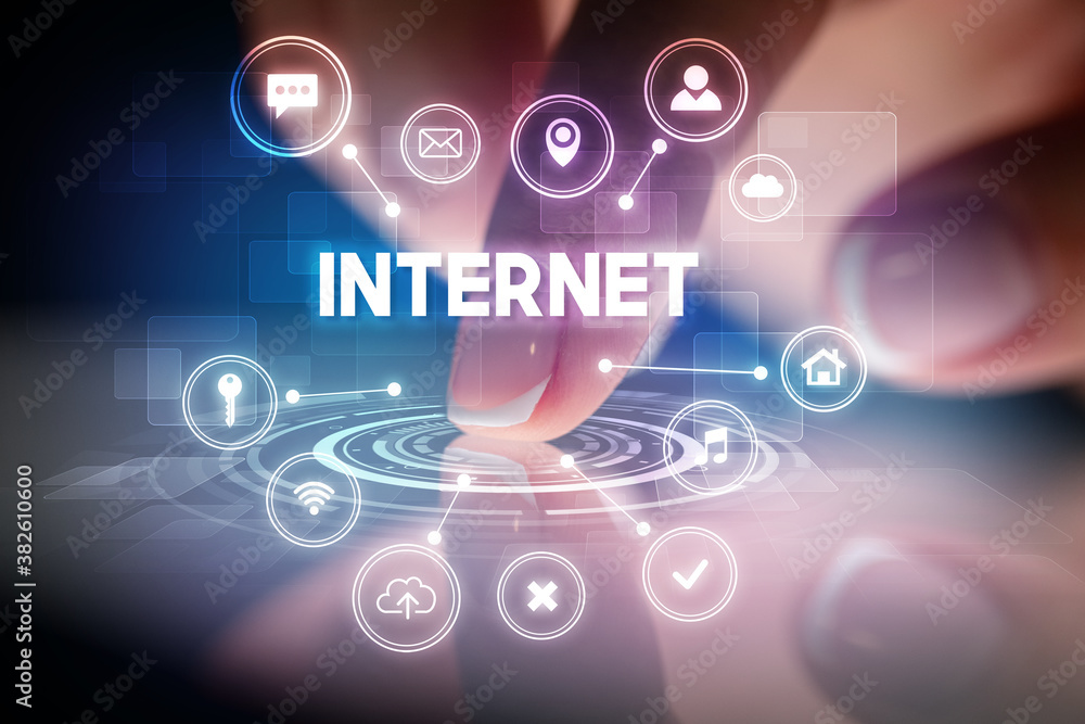 Finger touching tablet with web technology icons and INTERNET inscription, web technology concept Finger touching tablet with web technology icons and INTERNET inscription, web technology concept