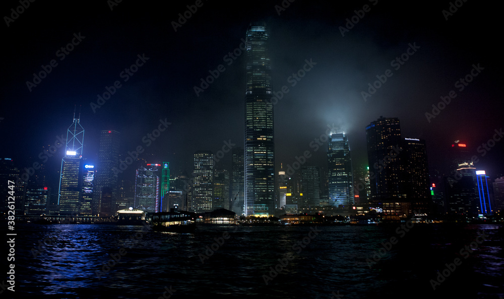 a night shot of the victoria harbour in hong kong