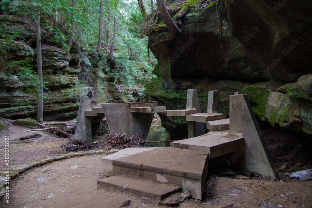 Hiking In Hocking Hills State Park. Stone bridge stairs over a ravine in the Old Mans Cave scenic area at Hocking Hills in Ohio. Hiking In Hocking Hills State Park. Stone bridge stairs over a ravine in the Old Mans Cave scenic area at Hocking Hills in Ohio.
