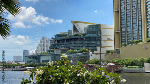 View across river to Icon Siam mall with palm tree