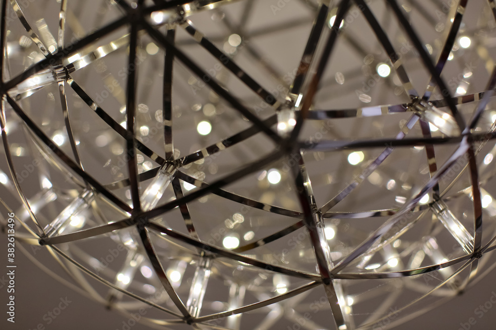 LED modern metal chandelier on the ceiling. LED modern metal chandelier on the ceiling.
