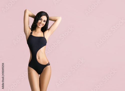 Slender and young girl with beautiful and fit body. Woman in swimsuit.