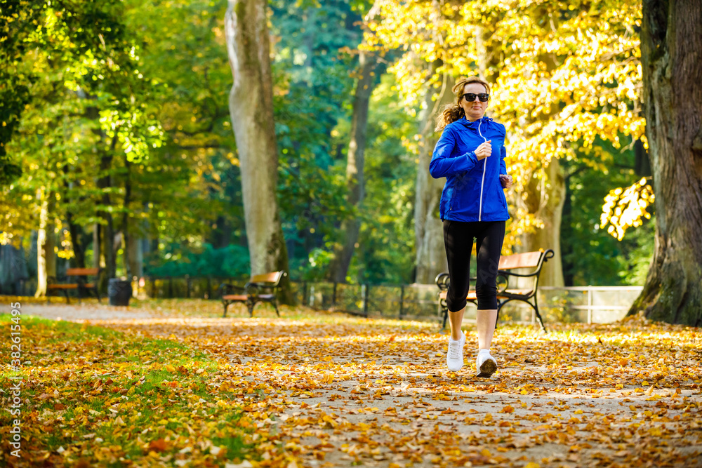 Fototapeta premium Healthy lifestyle - woman running in city park 
