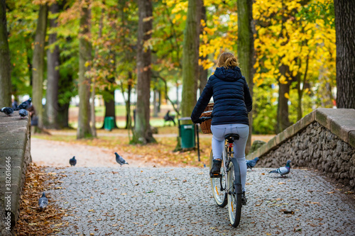 Urban biking - woman riding bicycle in city park  © Jacek Chabraszewski