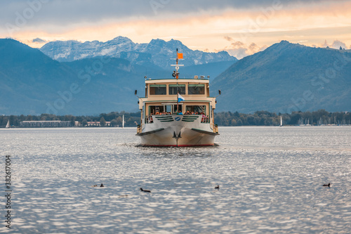 Tourist boat drives at Chiemsee in Bavaria, Germany. photo