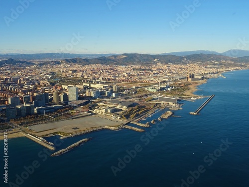 Port Forum Barcelona aerial view with blue sky, modern buildings, mountains, Sant Adria and Santa Coloma de Gramanet,
