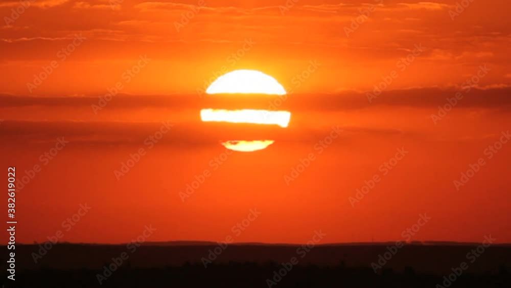 Big Orange Sun and Clouds, slow moviment. Sunrise time lapse. Magnificent scene. Big Orange Sun and Clouds, slow moviment. Sunrise time lapse. Magnificent scene.