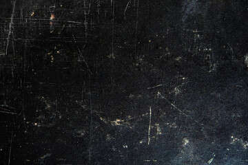 old cover of the book is a surface of black and gray, white scribbles with a damaged paint surface covered with cracks and grains.