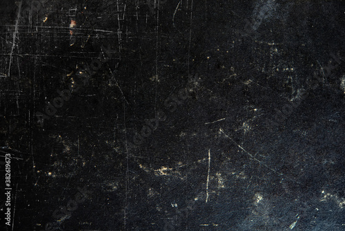 old cover of the book is a surface of black and gray, white scribbles with a damaged paint surface covered with cracks and grains.