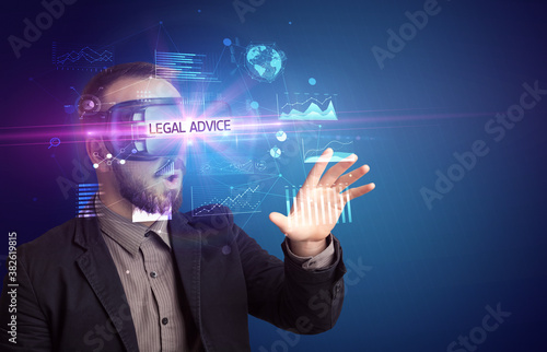 Businessman looking through Virtual Reality glasses with LEGAL ADVICE inscription, new business concept