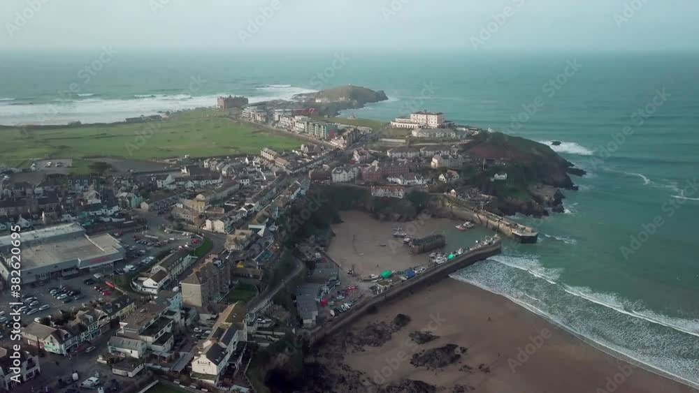 The Beautiful and Peaceful Island In Towan Beach, Newquay, Cornwall, England With Different Buildings and Calm Sea - Aerial Shot The Beautiful and Peaceful Island In Towan Beach, Newquay, Cornwall, England With Different Buildings and Calm Sea - Aerial Shot