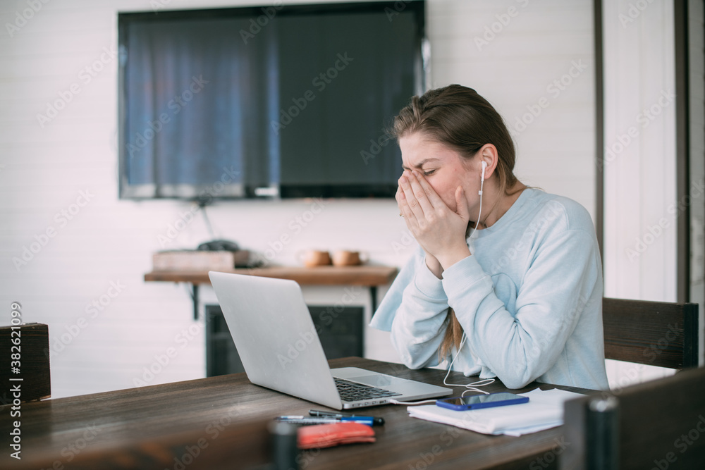Woman is sick and works on laptop at home. Woman is sick and works on laptop at home.