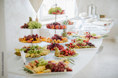 Different variety of fresh fruits on the buffet table at the celebration