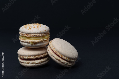 Appetizing macaroni of white color are located on a black background. Side view