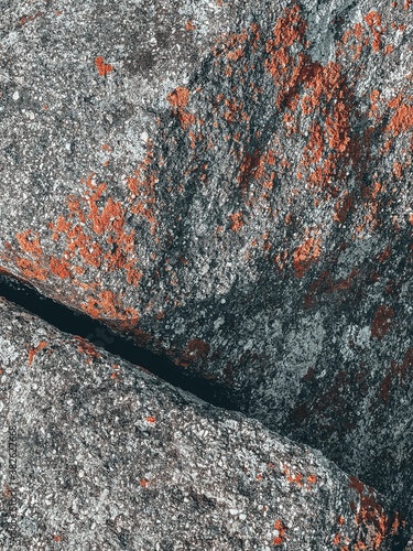 Closeup of garnet amphibolite granite texture, vertical shot photo