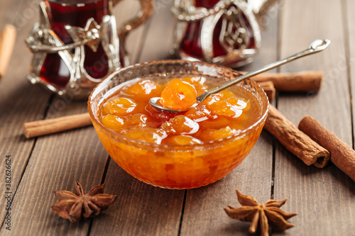 White cherry jam in bowl on wooden background