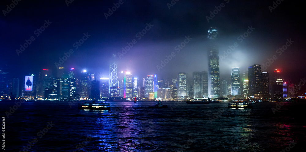 a night shot of the victoria harbour in hong kong