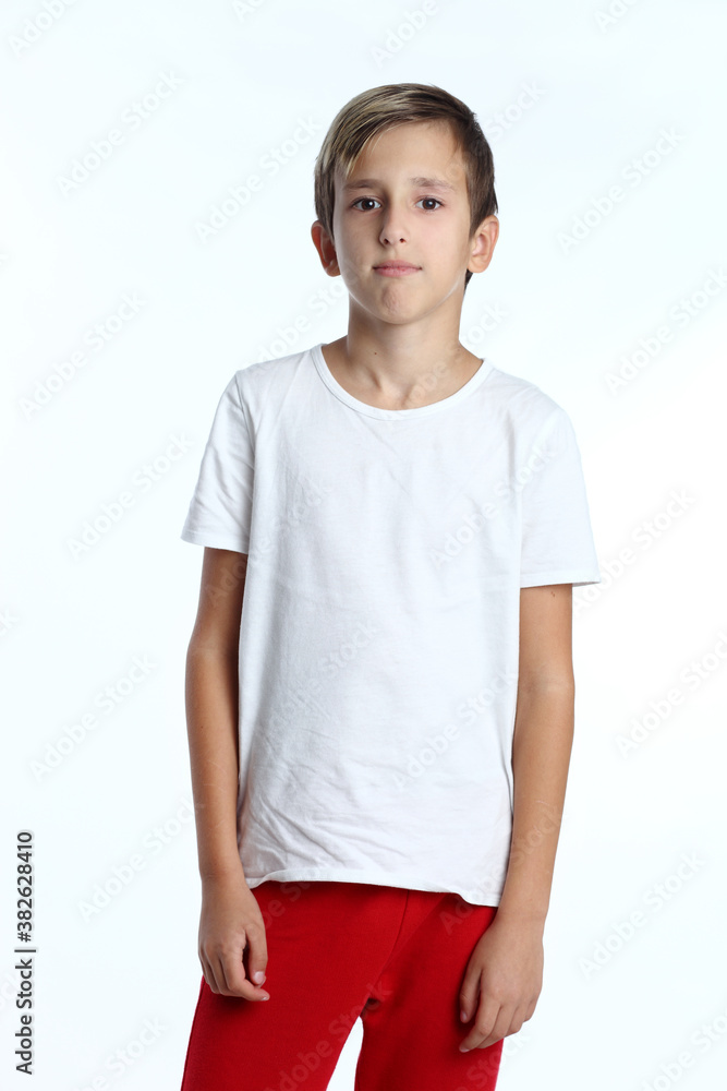 Young pretty boy posing at studio as a fashion model. Young pretty boy posing at studio as a fashion model.