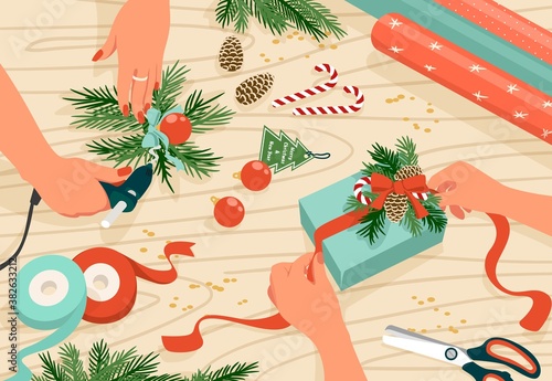 Christmas present. Cartoon hands preparing for New Year celebration, signing invitation letters and packing colorful presents. December holiday activity, DIY store advertising. Vector top view scene