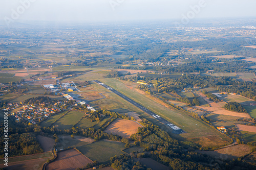 Fotografija aerial view of small airfield at sunset