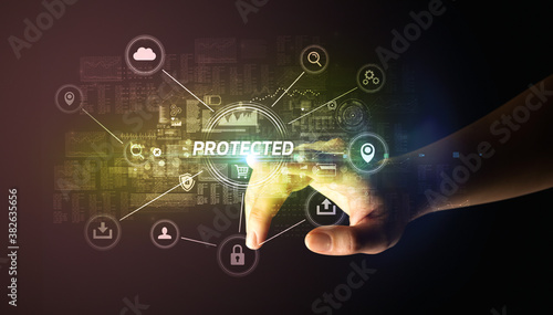 Hand touching PROTECTED inscription, Cybersecurity concept