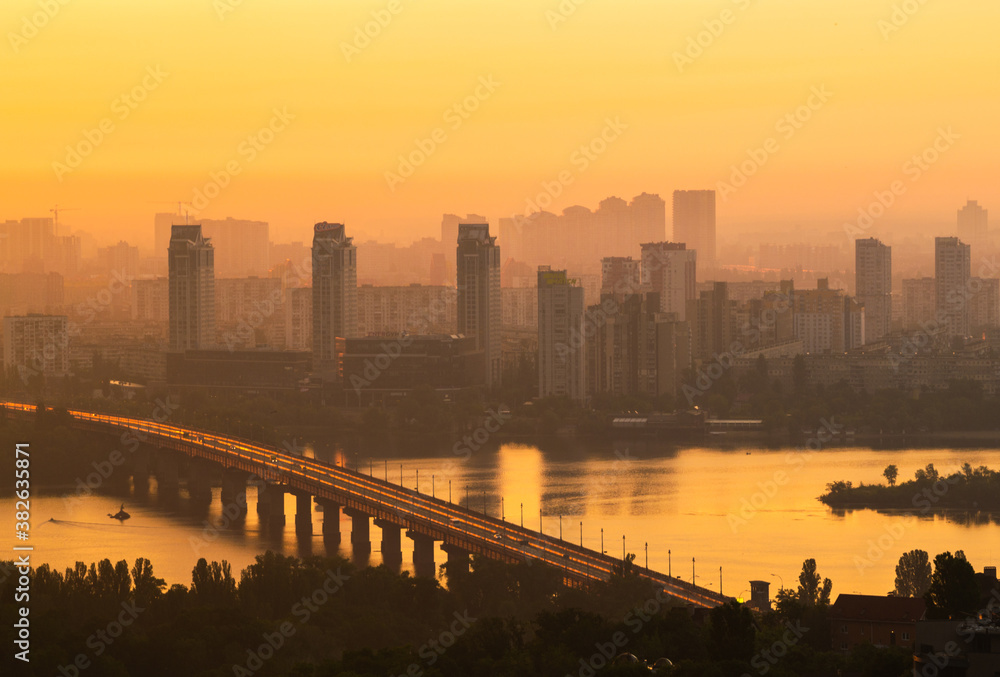 Patona bridge at the golden dawn, Kiev, Ukraine. Left bank of the city, Dnipro river Patona bridge at the golden dawn, Kiev, Ukraine. Left bank of the city, Dnipro river