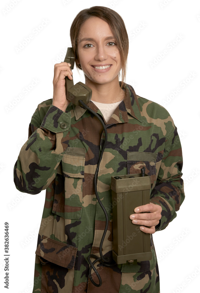 Smile woman soldier talking on military telephone, communicating, isolated in white background Smile woman soldier talking on military telephone, communicating, isolated in white background